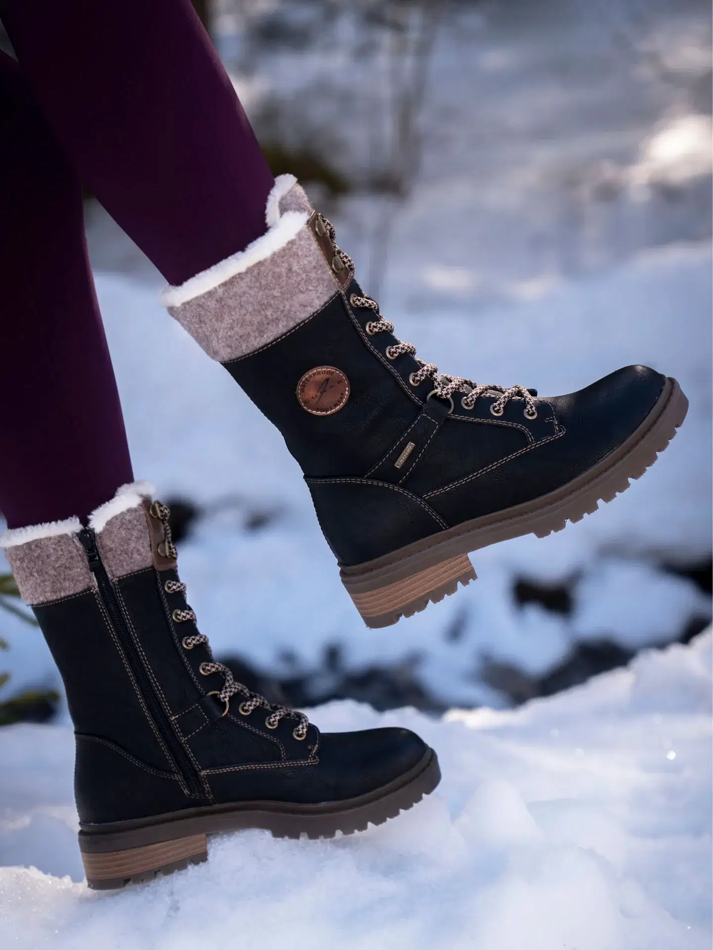 Mid Calf ankle boot with lace front and side zip. Featuring a waterproof upper and dura grip technology perfect for icy weather